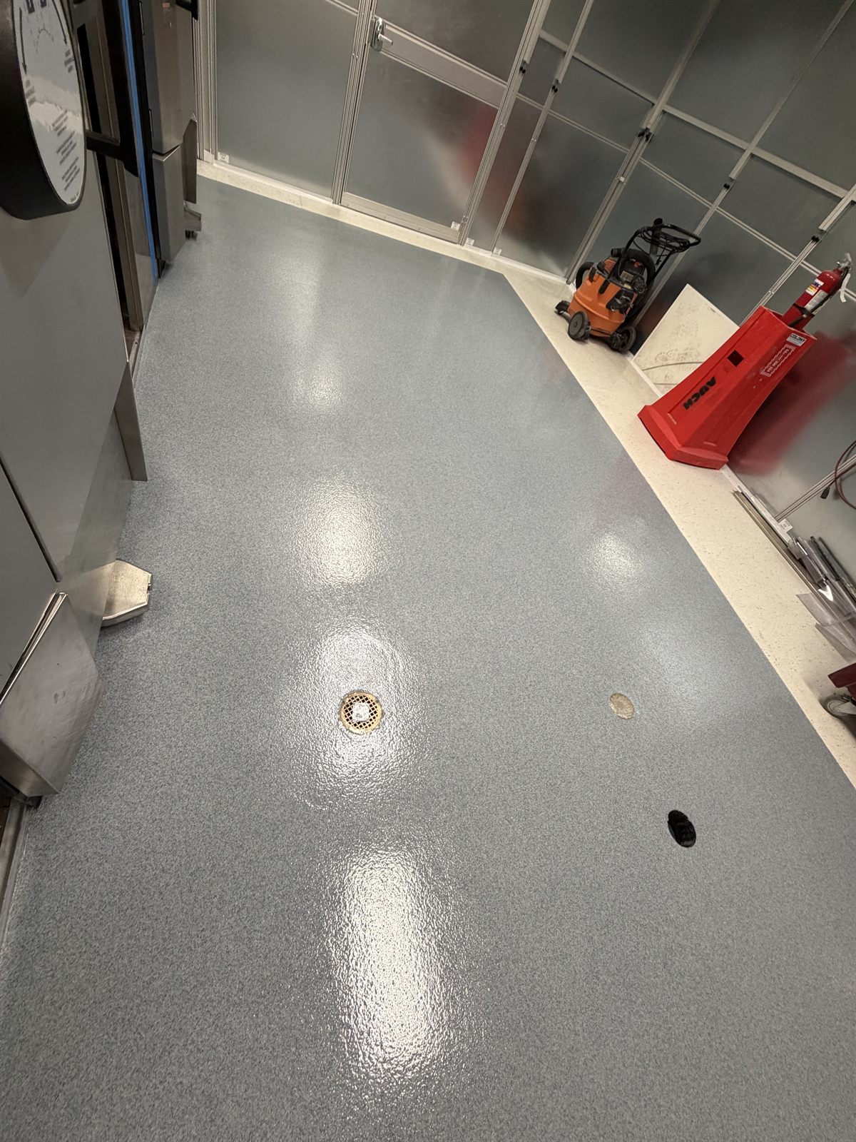 MavCrete UQ-HD heavy-duty urethane quartz floor with drain in a wet-process area