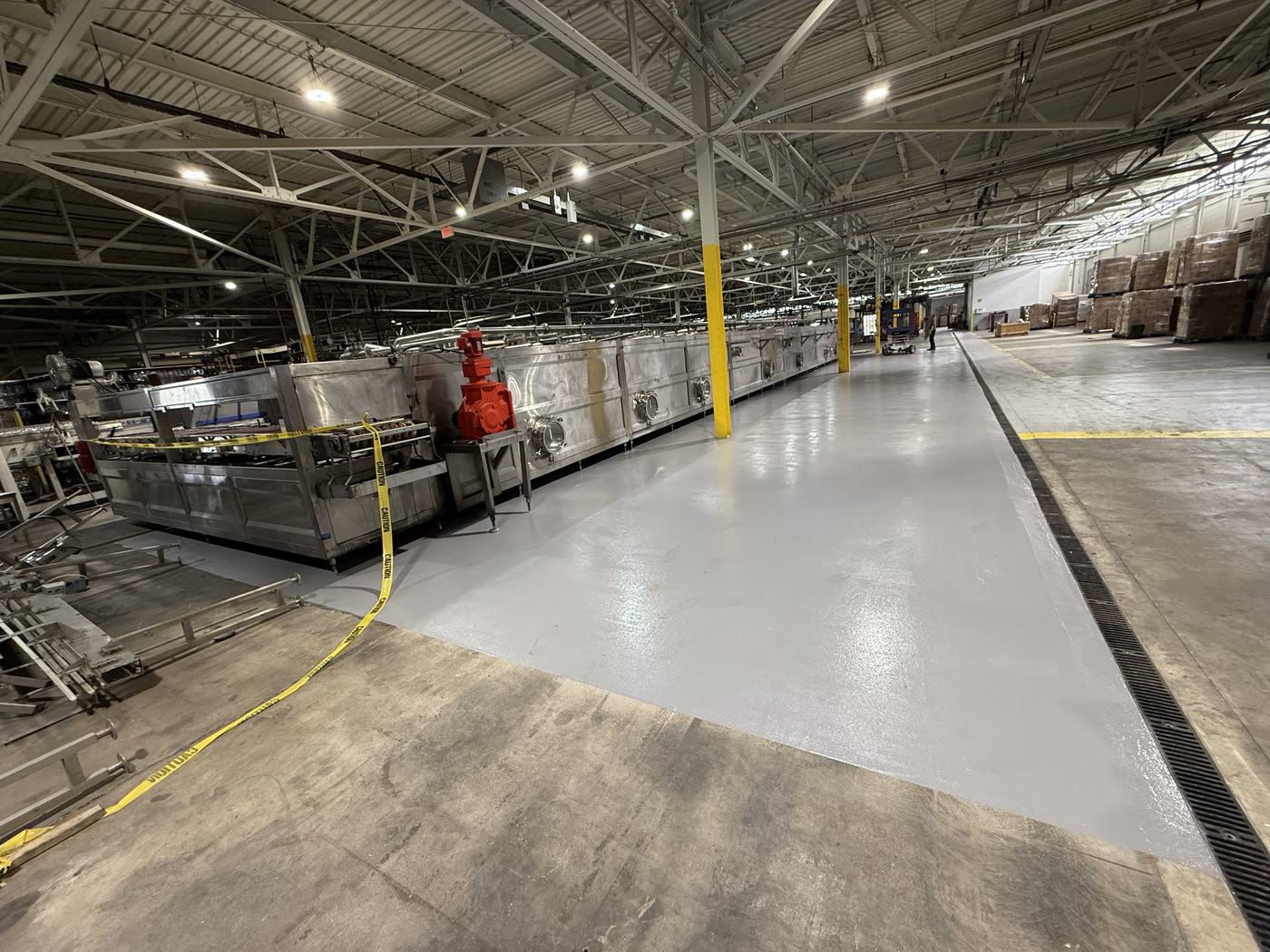 Finished floor in the condenser area, coated beneath equipment with the custom 25-foot squeegee