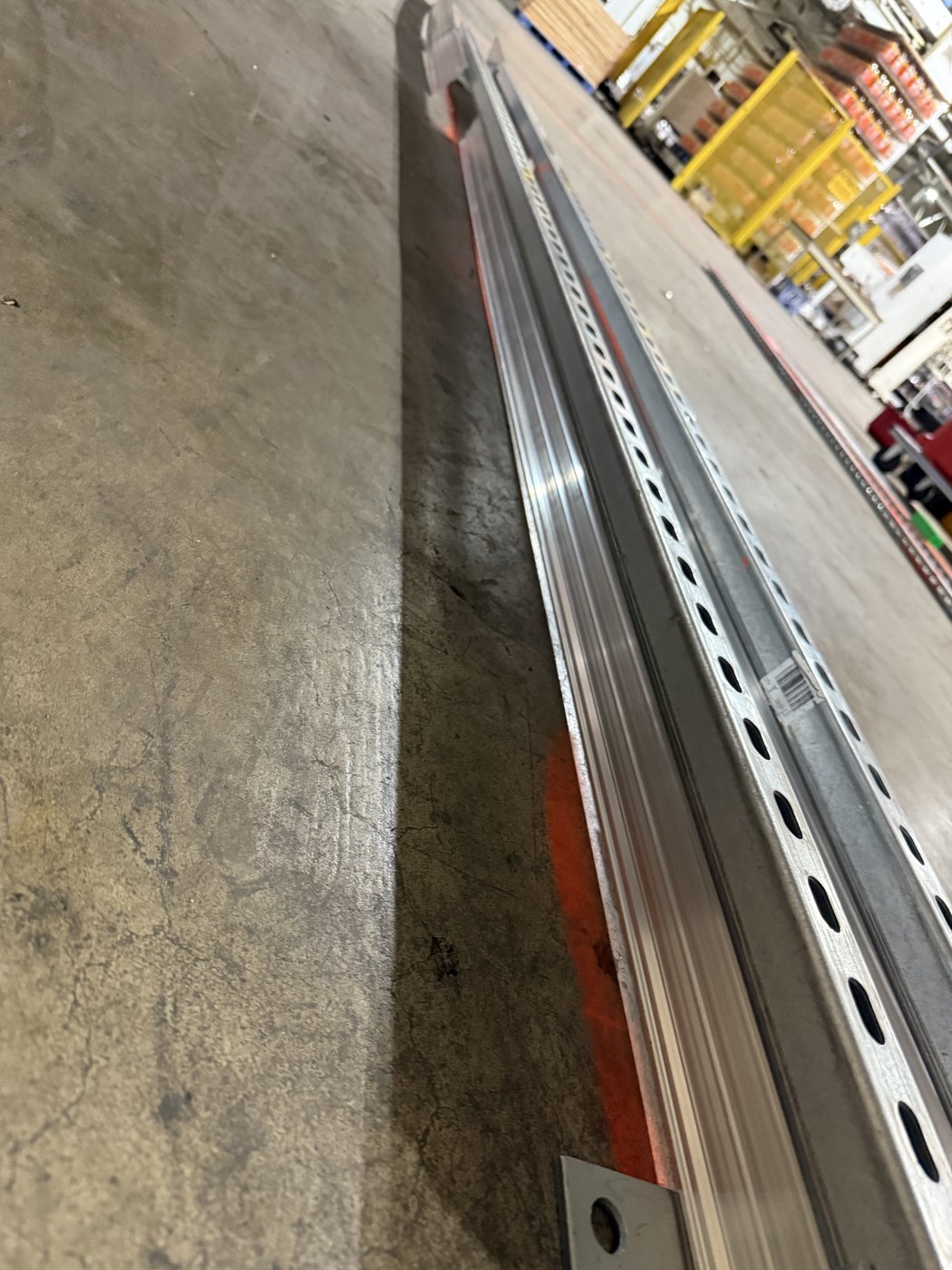 Perforated aluminum rapid-strip curb form set to the layout line