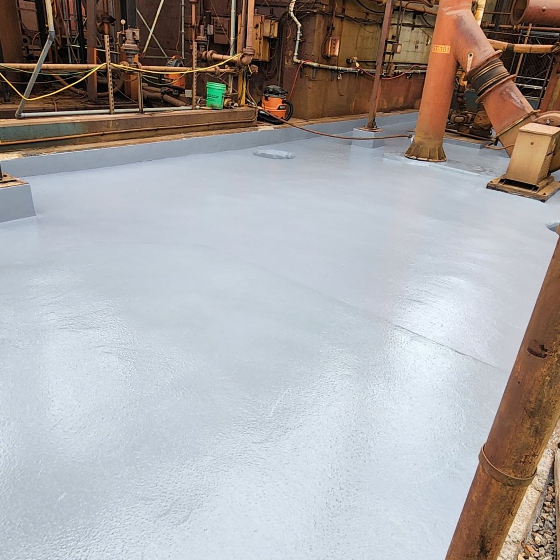 Collage of secondary containment installation work at a chemical facility