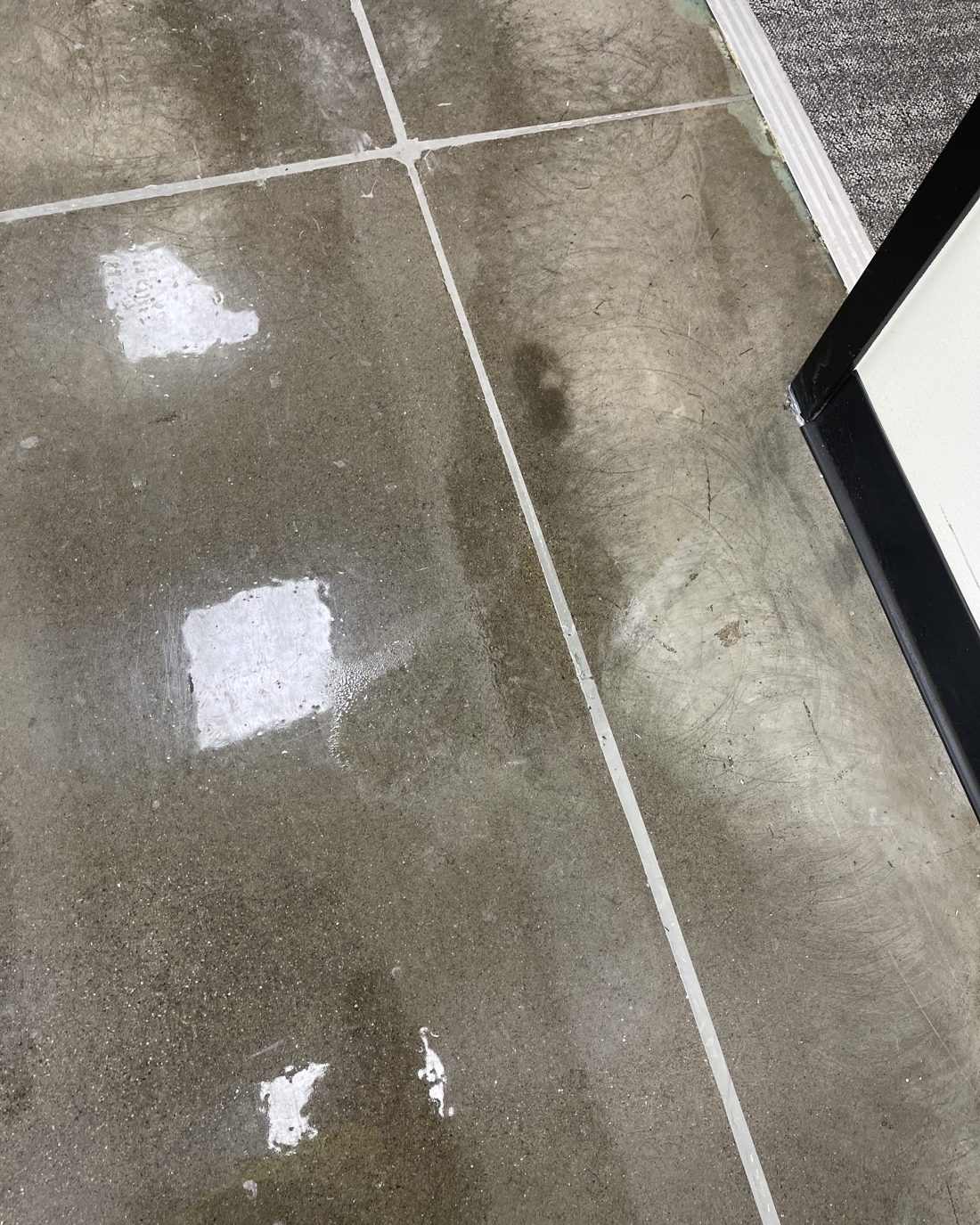 Sealed concrete floor with control joints filled flush