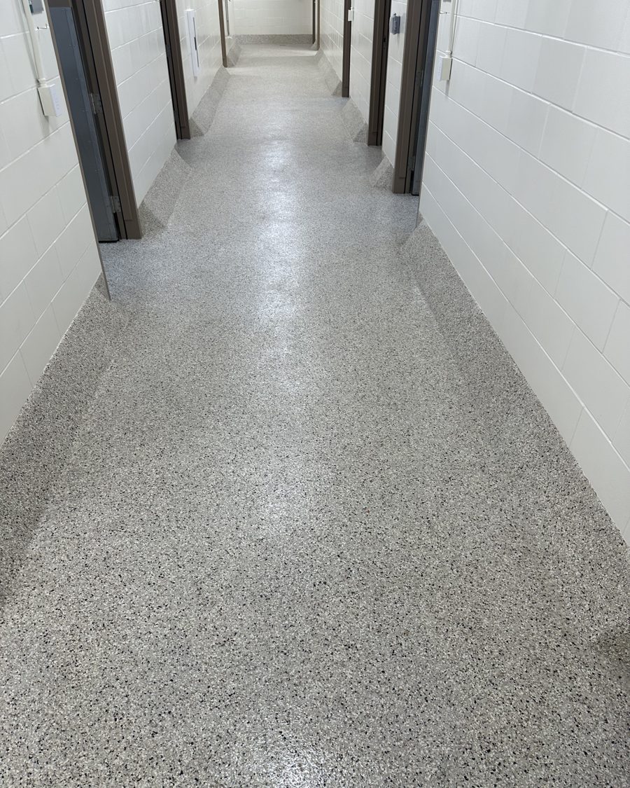 University vivarium corridor with seamless flake broadcast floor and integral cove bases