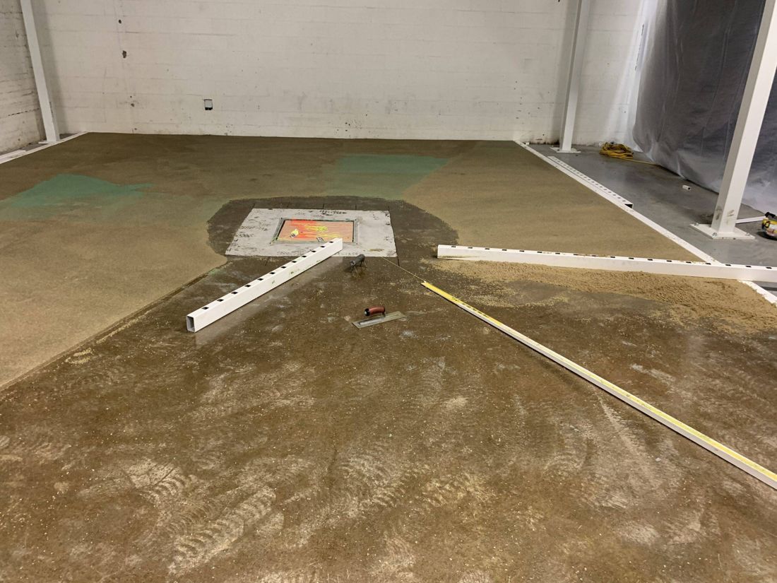MavPolyPatch screeded around in-floor plate, industrial plant — during installation
