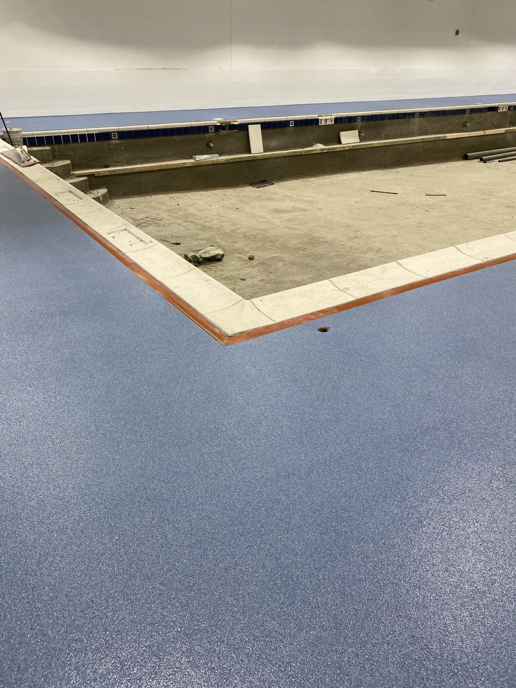 MavTop UQB quartz broadcast pool deck, swim school — after installation