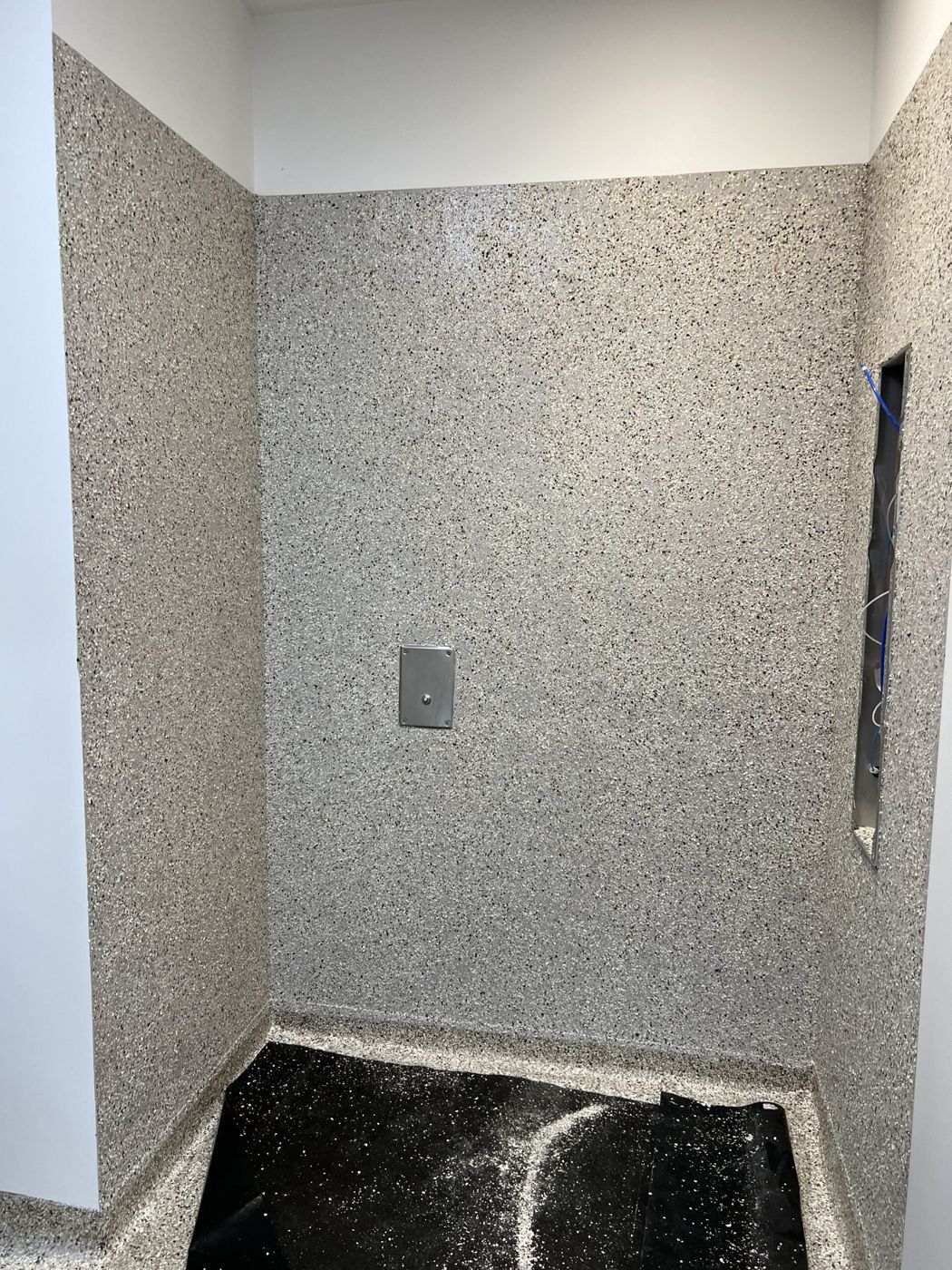MavTop UQB broadcast wall system, health center shower area, Grand Rapids — after installation