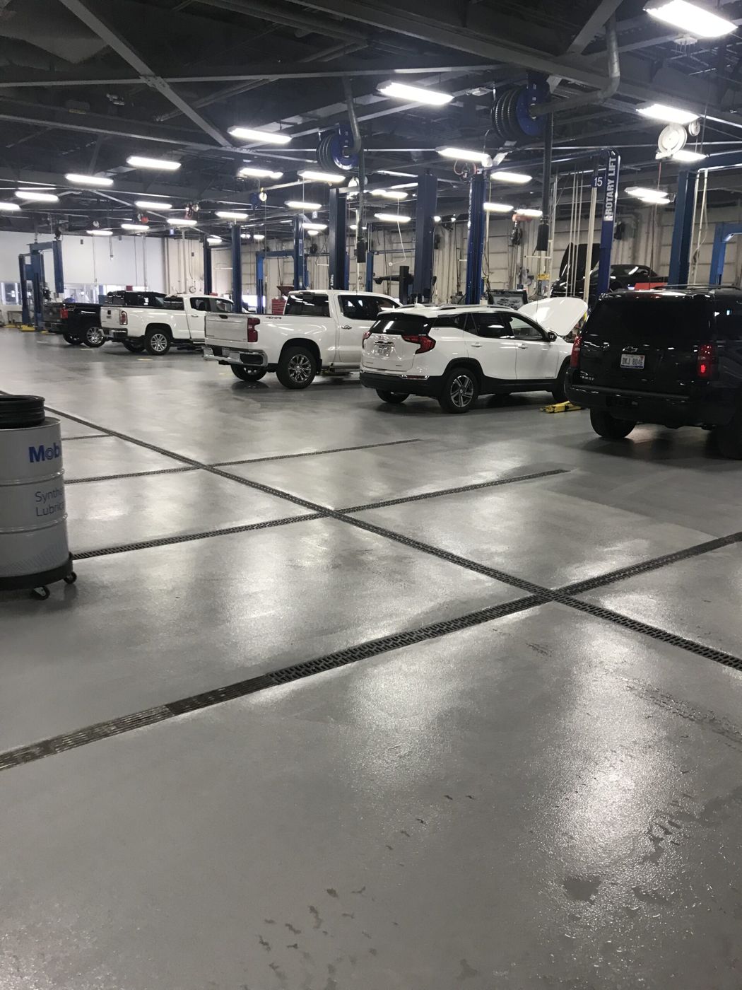 Quartz broadcast service floor with trench drains, automotive service operations facility, Warren — after installation