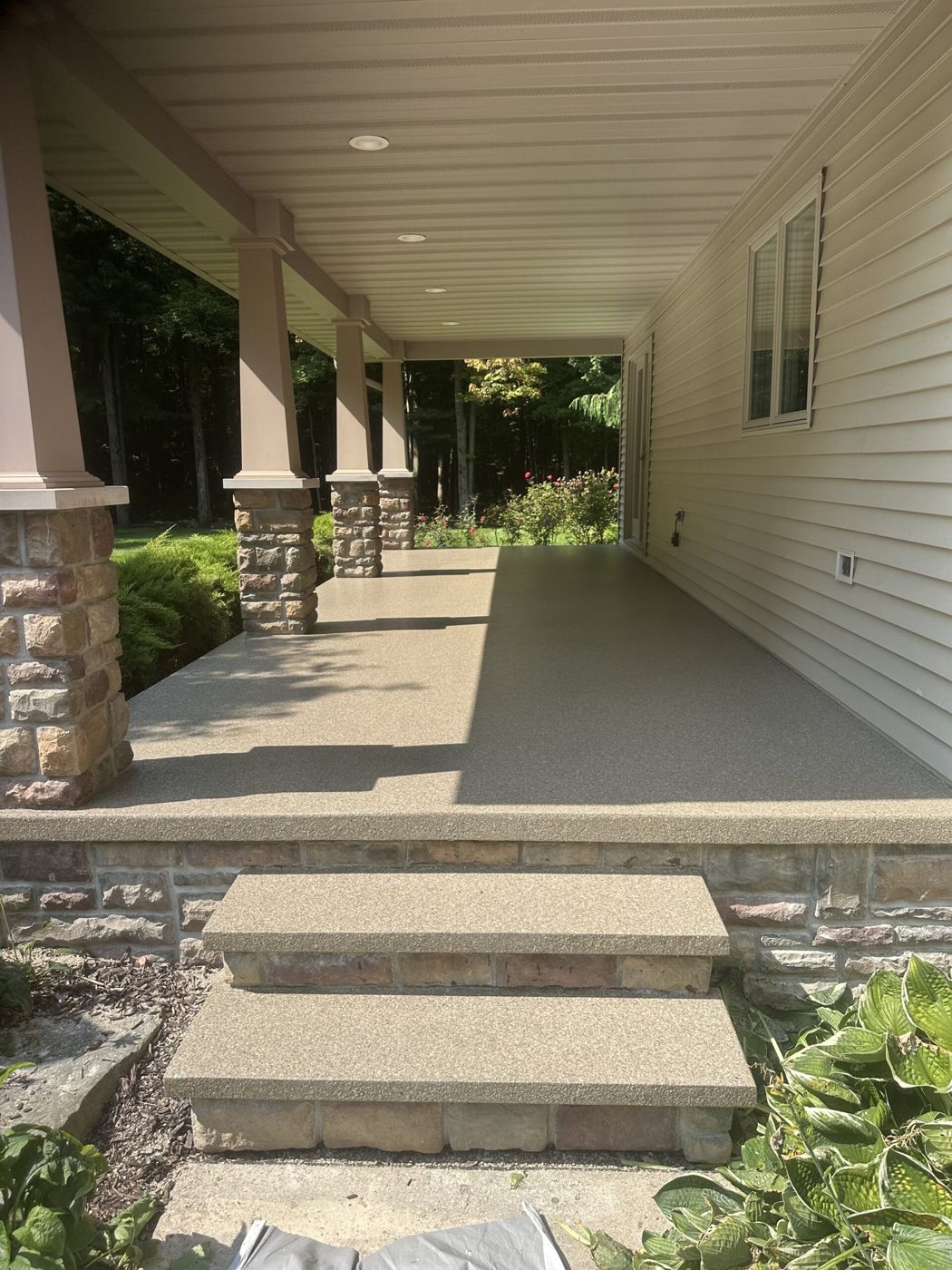 MavTop UQB quartz broadcast on covered porch and steps — after installation