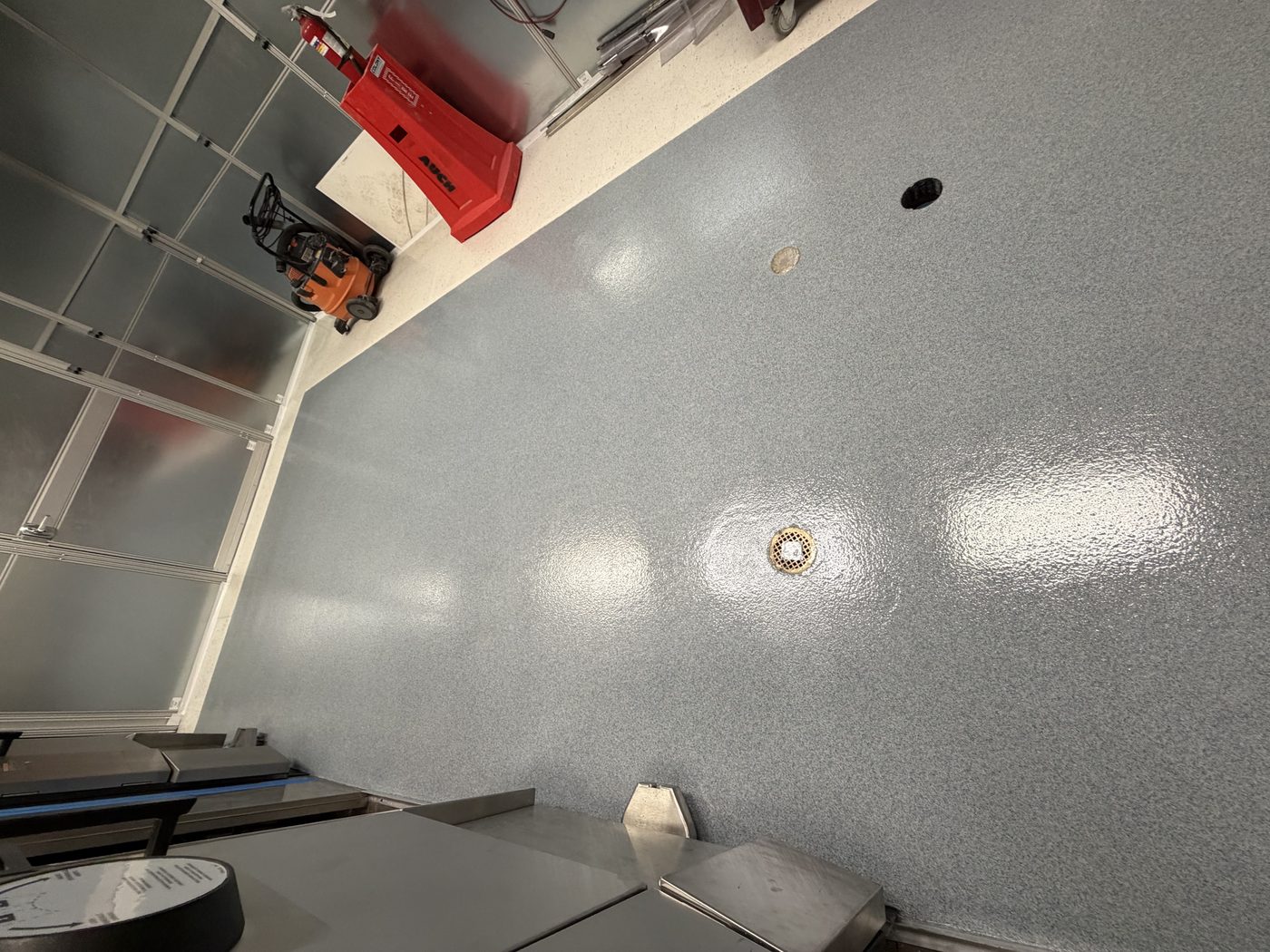 MavCrete UQ-HD quartz broadcast floor sloped to drains, commercial kitchen — after installation