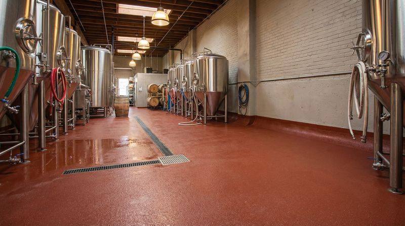 Brewery production floor with urethane cement flooring around tanks
